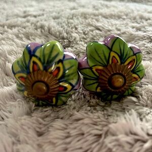 Two hand painted door knobs.